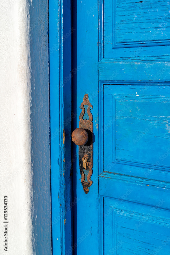 Fototapeta premium Detail view of old vintage wooden door with metal door knob.