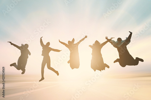 Silhouette of International cheering new generation jump on beautiful background. concept for running activity, relax lifestyle, hope faith love, growing seller: Trader Happiness for stock market. 