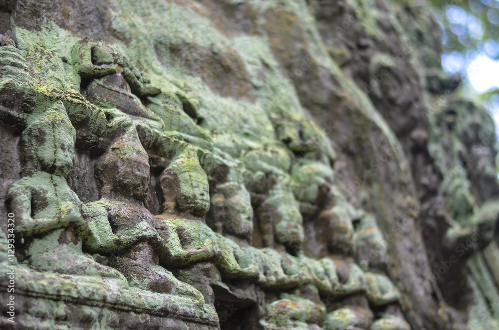 Ancient Apsara Dancers Stone Carving all around on the wall at Angkor wat one of Seven Wonders SiemReap, Cambodia