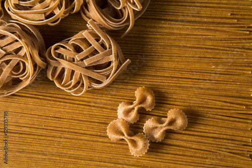 Variety of types and shapes of dry Italian integral pasta