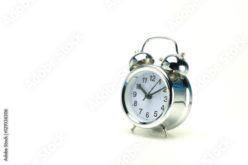 10:10 O' Clock silver alarm clock on white background, Timing co