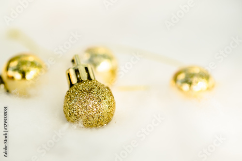 Gold glitter Christmas decor balls isolated on white background
