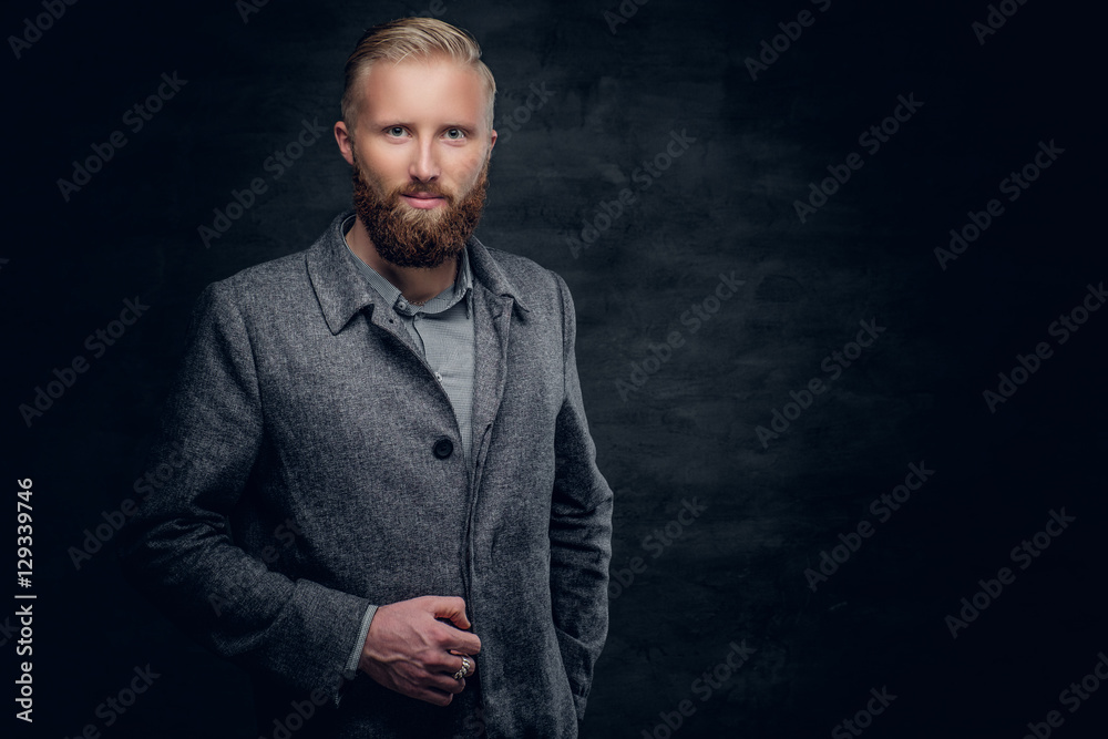 Bearded blond male dressed in elegant, classic jacket.