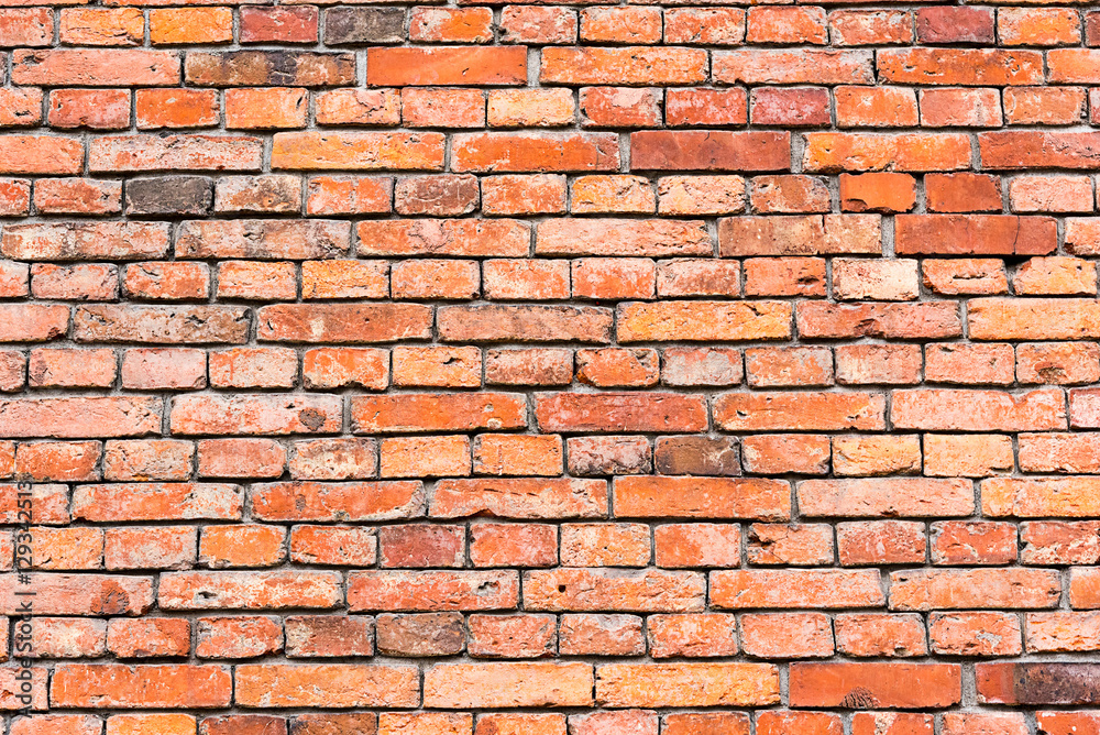 Background from an old and rugged red brickwall Background from an old and rugged red brickwall