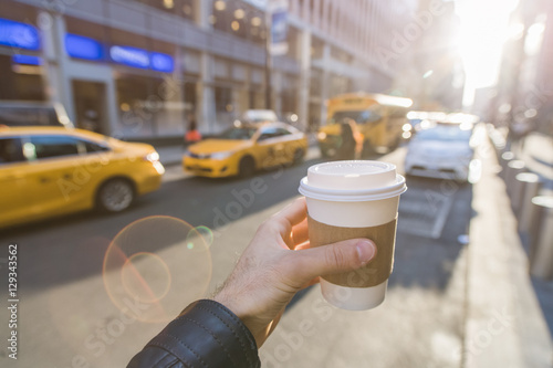 Photography Hand holding coffee cup in New York City