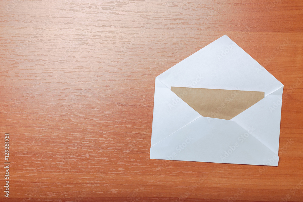 Photo of blank envelope on a wooden background Photo of blank envelope on a wooden background