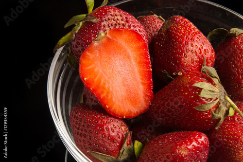 strawbery  ftuit on the black background. photo