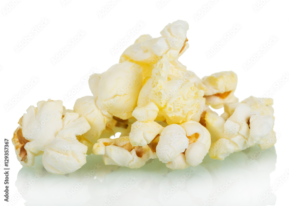 Pieces of salted popcorn isolated on white