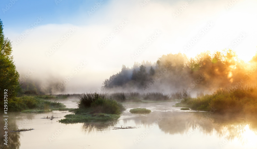 Sunrise on the river with fog.