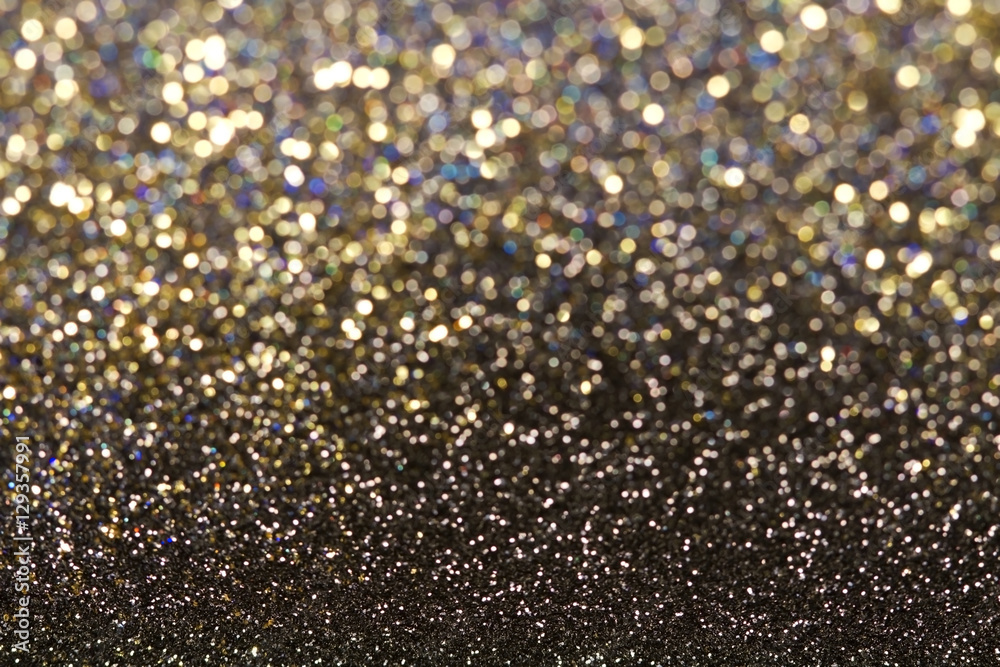 Glitter and glow soft gold bokeh shining light abstract dreamy sparkle background