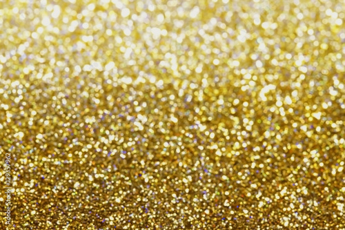 Glitter and glow soft gold bokeh shining light abstract dreamy sparkle background