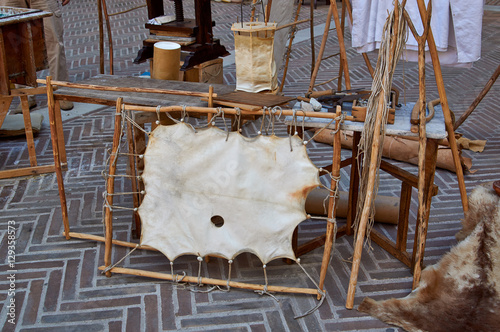 Village fair vintage Handicrafts. Pottery, leather and wooden objects on table.
