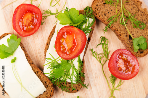 Cheese sandwich with parsley and dill tomato.