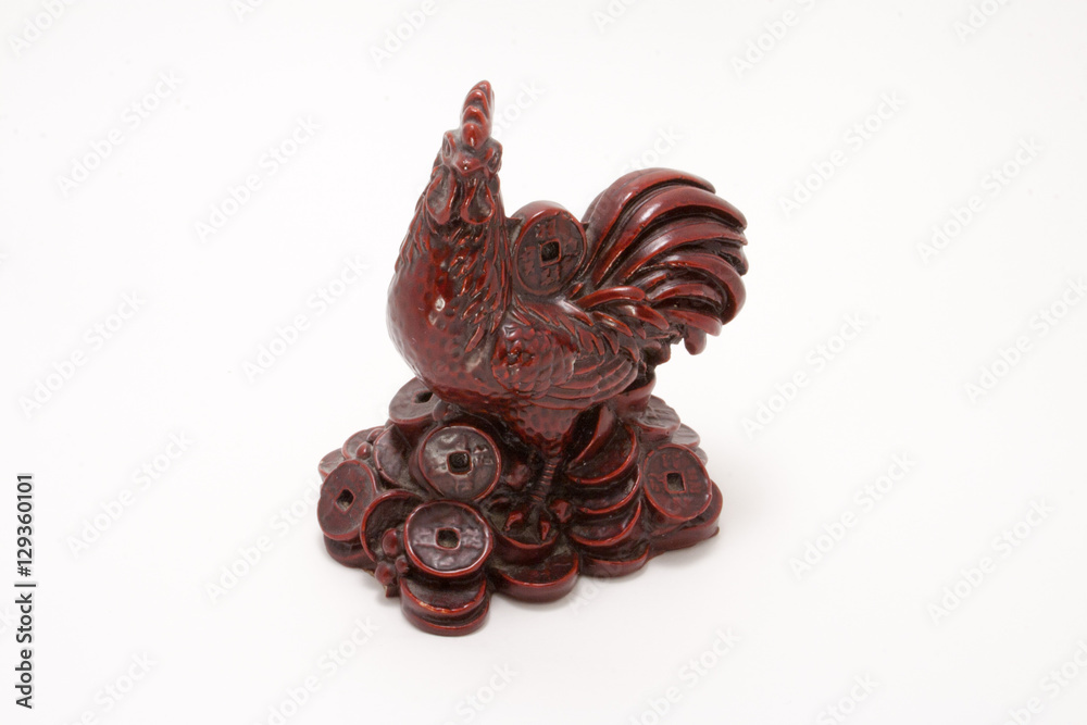 beautiful red rooster figurine with coins isolated on white background
beautiful red rooster figurine with coins isolated on white background