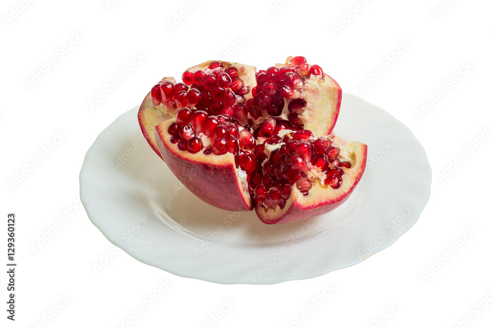 Pomegranate slices and garnet fruit seeds on table. Pomegranate whole. Useful fruit. Pomegranate slices and garnet fruit seeds on table. Pomegranate whole. Useful fruit.
