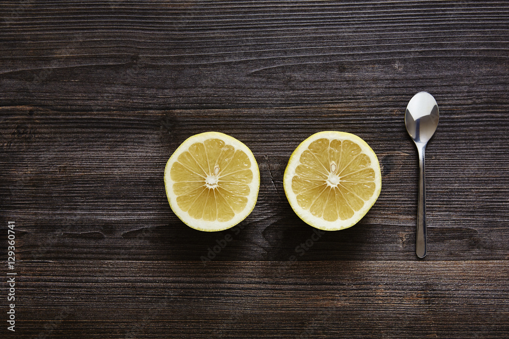 two slice citrus fruits with spoon two slice citrus fruits with spoon