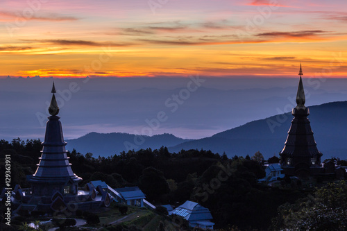 two famous pagodas and colorful sky at sunrise. Doi Inthanon national park, Thailand photo