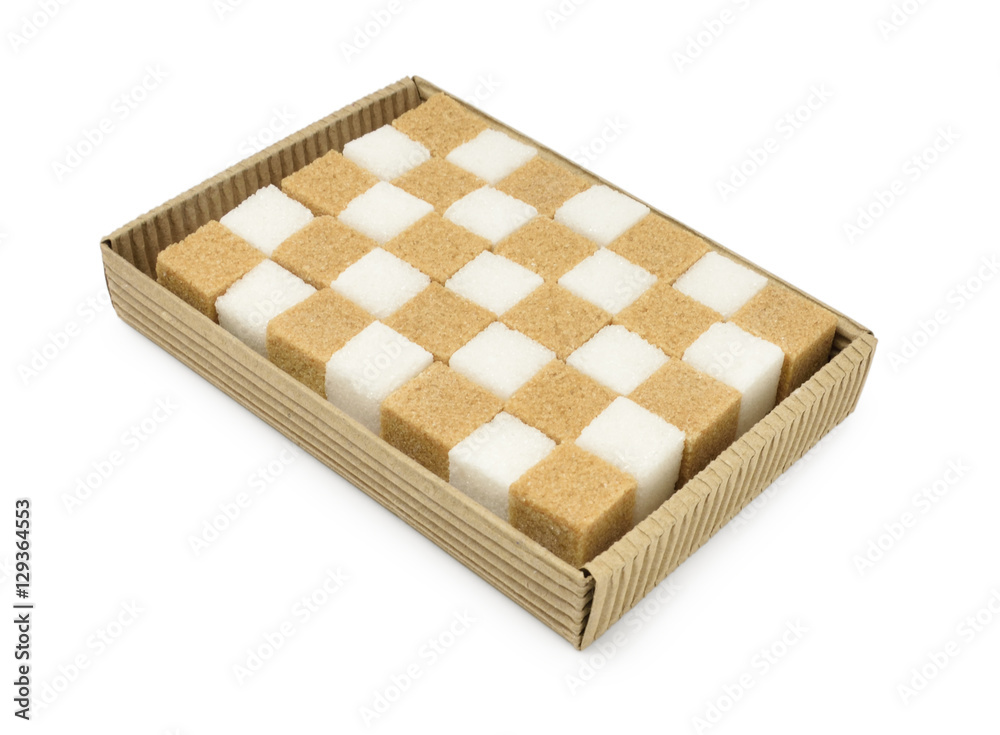 Corrugated box with brown and white sugar cubes isolated on white Corrugated box with brown and white sugar cubes isolated on white