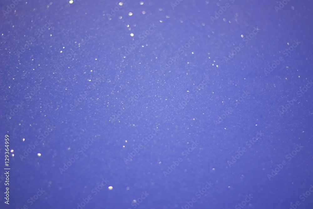 Fototapeta premium Sparkling Snow, Dark Blue Winter Christmas Pattern with Bokeh and stars.