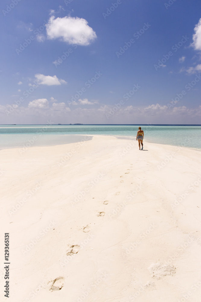 Woman Walking Alone in The Maldives Woman Walking Alone in The Maldives