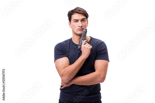 Aggressive young man with gun isolated on white