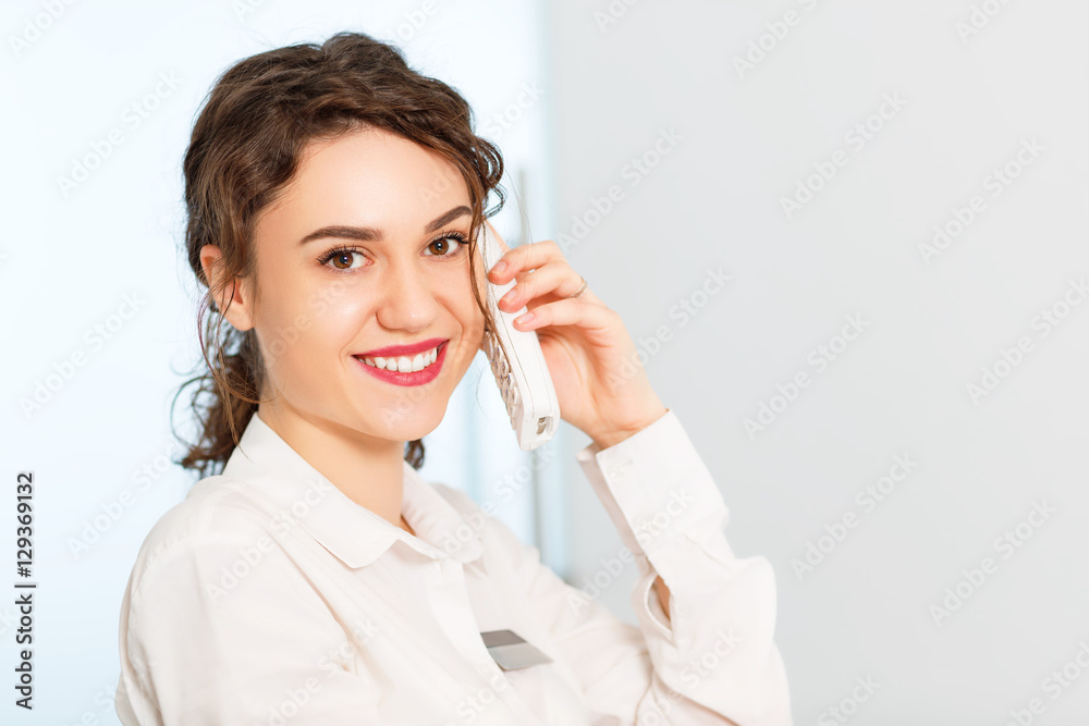 friendly woman behind reception desk administrator friendly woman behind reception desk administrator