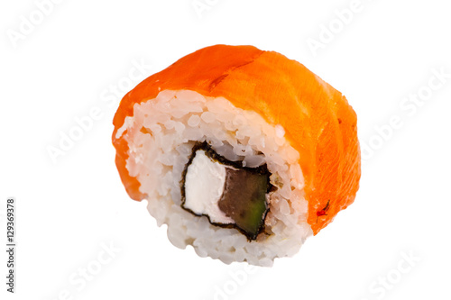 Japanese roll rice, nori, avocado, cheese, salmon . Close-up on