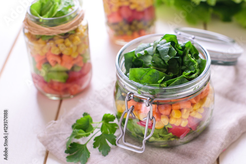 Homemade healthy salads with vegetables in jar