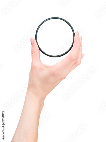 Hand holding photo ND filter. On white with clipping path