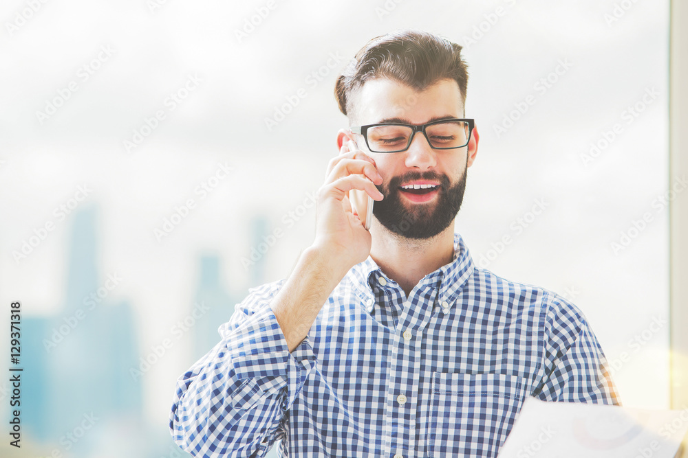 Handsome male with document on phone Handsome male with document on phone