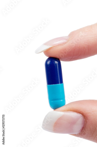 hand holds pill