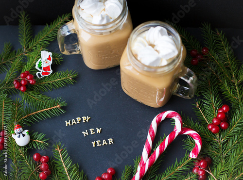 marshmellou cocoa, Christmas tree with decorations on a black background photo