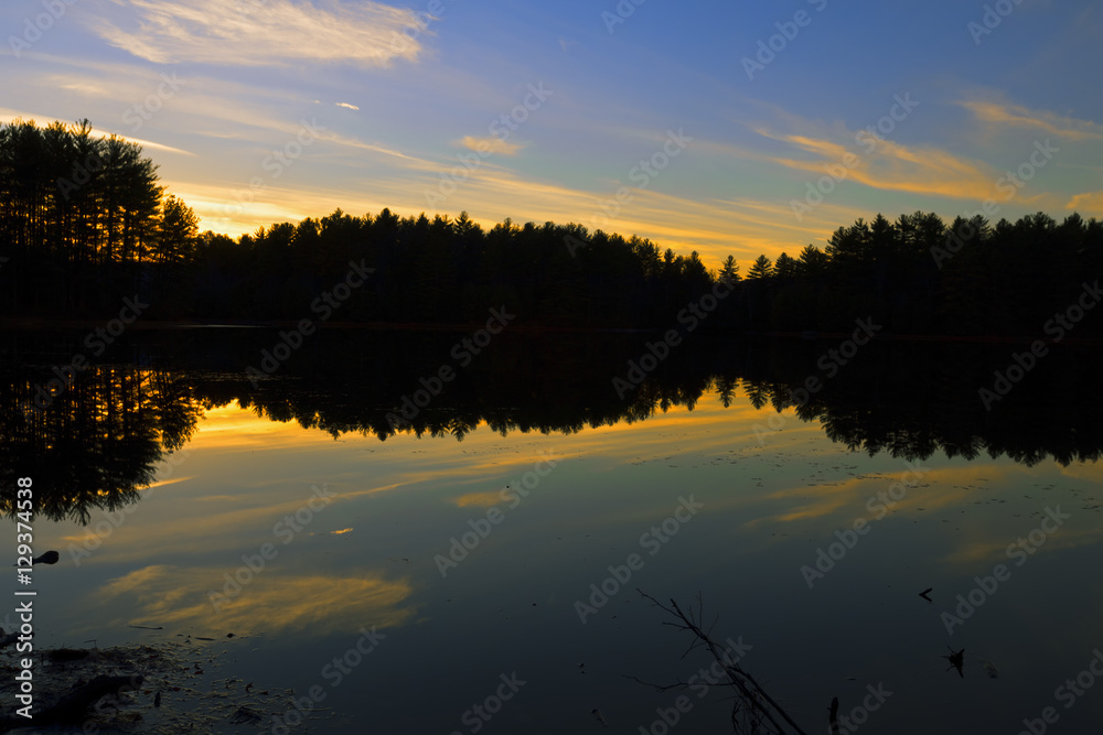 Sunset on a forest lake.