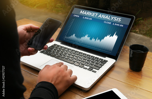 Man Analysis the Market on Computer MARKET ANALYSIS,  Business T