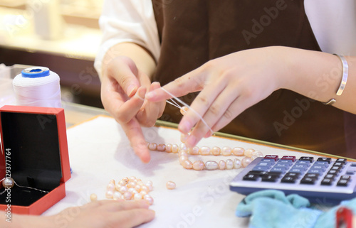 Worker in the production of Pearl Necklace