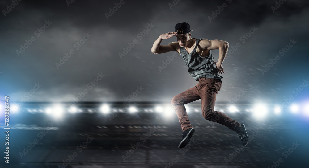 B-boy performing some moves . Mixed media B-boy performing some moves . Mixed media