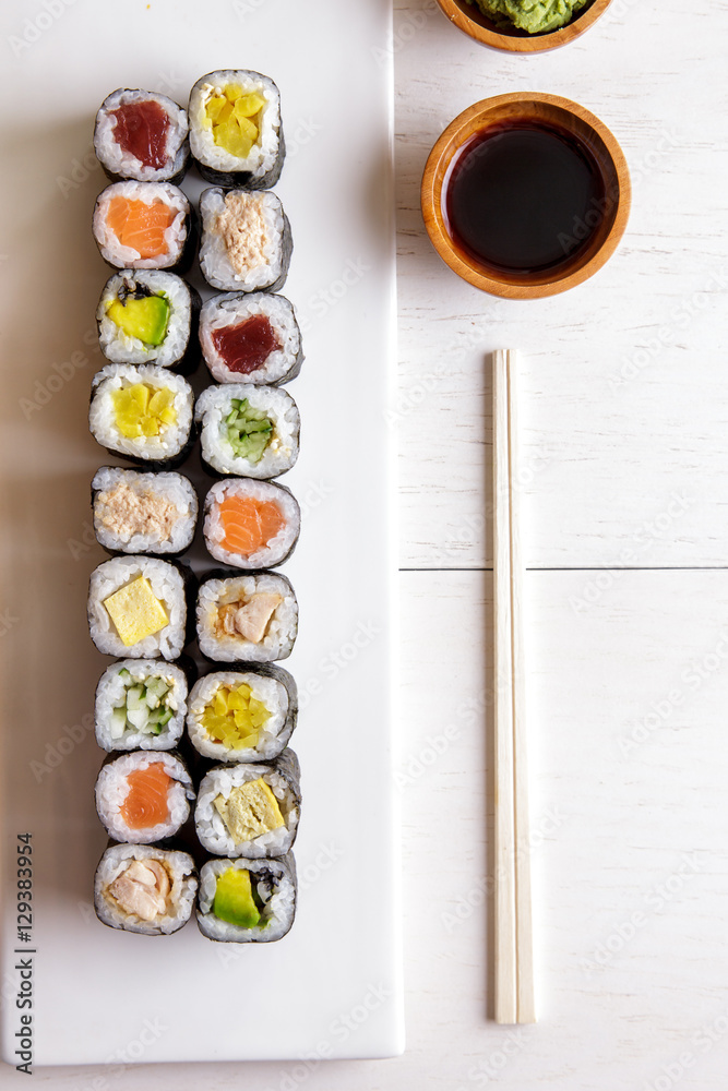 japanese food mini maki sushi platter on white wooden table japanese food mini maki sushi platter on white wooden table