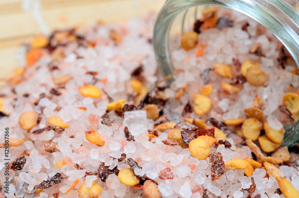 pink salt with chili seed on table
