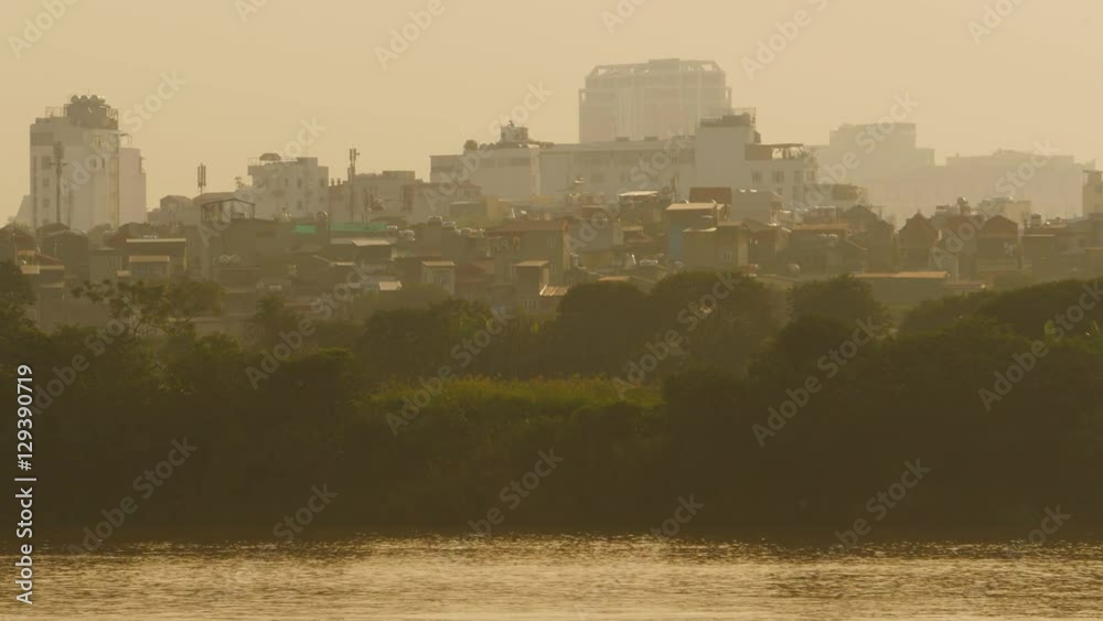 Hanoi city in the evening haze 2. Overlooking the river. Vietnam.