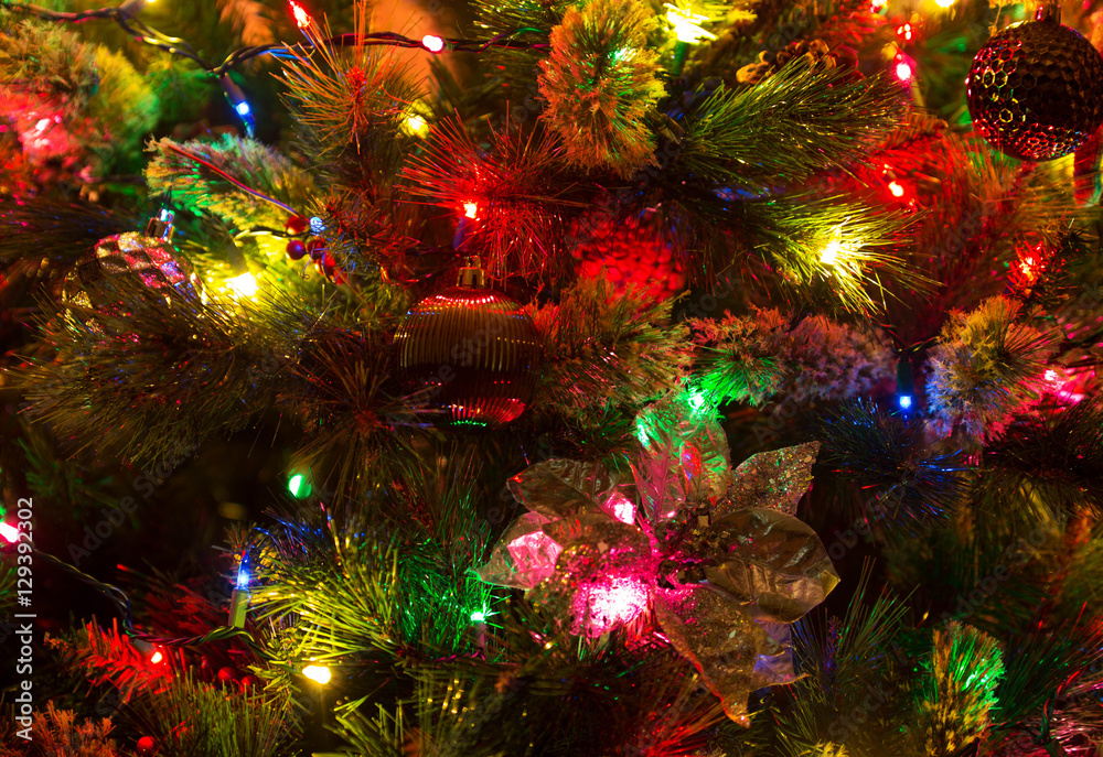 Close up of glowing lights and decorations on a Christmas tree Close up of glowing lights and decorations on a Christmas tree