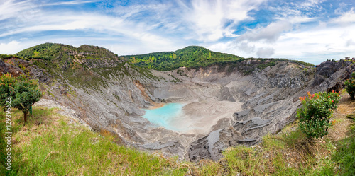 Panoramic view of Tangkuban Perahu crater, showing beautiful and huge mountain crater, at the morning,illuminated by sunlight.  There also a blue sky and beautiful cloud