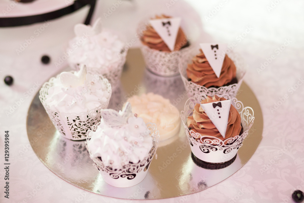 Fototapeta premium Sweet candy bar set at wedding ceremony, confectionery