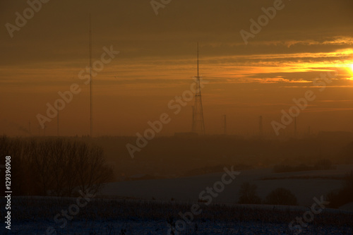 Sunrise over snow covered fields in Belgium