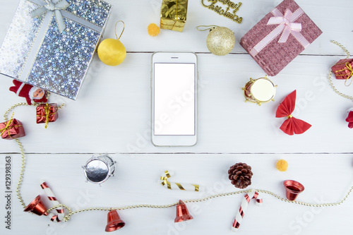 Smartphone with blank screen in Christmas decoration background. seasonal concept.