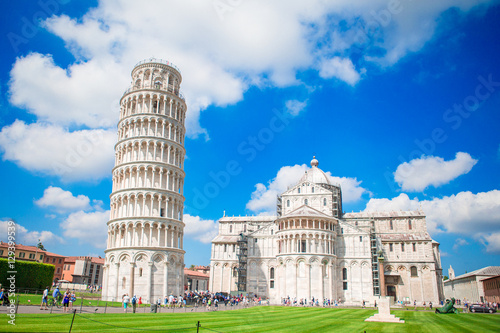 Tourists visiting the leaning tower of Pisa , Italy