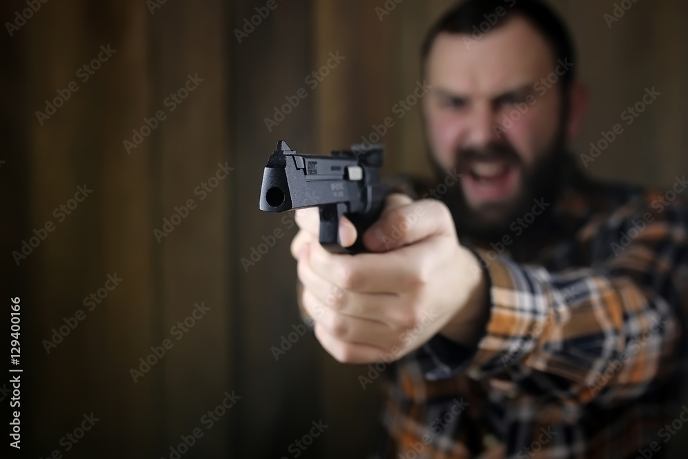 man with put on protective goggles and ear training in pistol sh man with put on protective goggles and ear training in pistol sh
