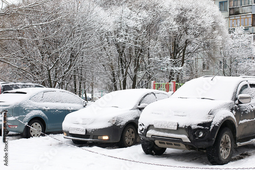 car in a winter morning with snow covered © alexkich