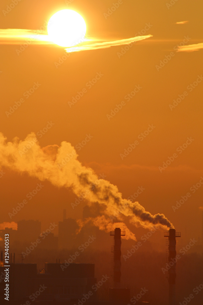 Smoke from industrial chimneys at dawn