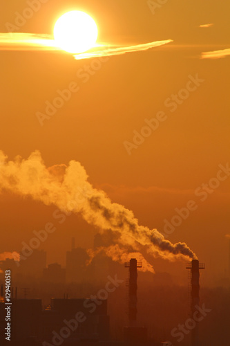 Smoke from industrial chimneys at dawn