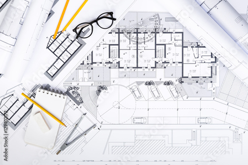 Construction plans with drawing Tools on blueprints